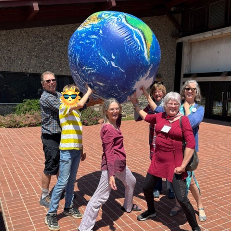 Get involved at UUCB - people holding up a globe