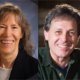Dr. Barbara Minton and Peppino D'Agostino - Music Healers. Woman with shoulder length brown hair smiling (Dr. Barb) and Man (Peppino D'Agostino) with short brown hair, smiling while holding a guitar.